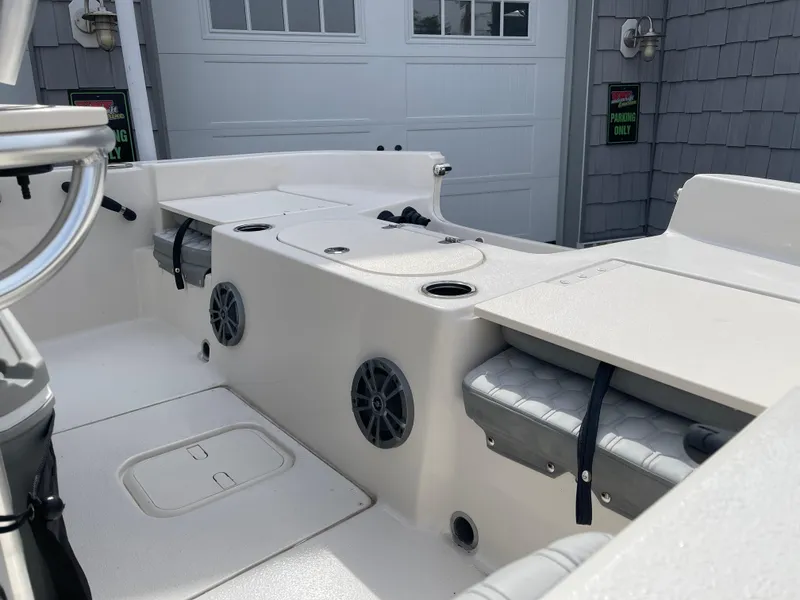 Slide: The Image of 2025 Carolina Skiff 19 LS boat interior with seating and storage compartments. - 11