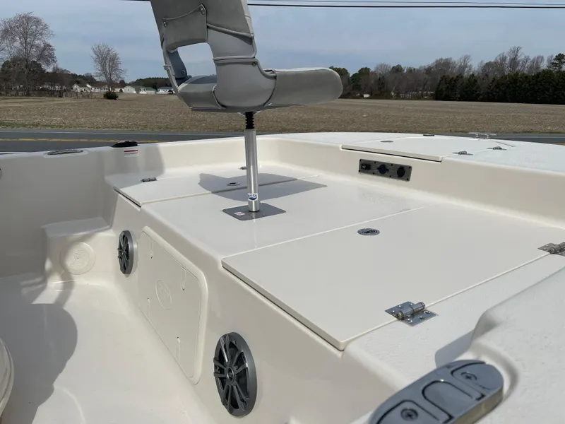 Slide: The Image of 2025 Carolina Skiff 19 LS boat interior with seating and storage compartments. - 12