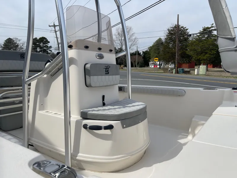 Slide: The Image of 2025 Carolina Skiff 19 LS boat interior with seating and storage compartments. - 13