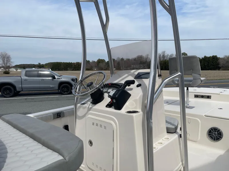 Slide: The Image of 2025 Carolina Skiff 19 LS boat interior with steering console and seating. - 16