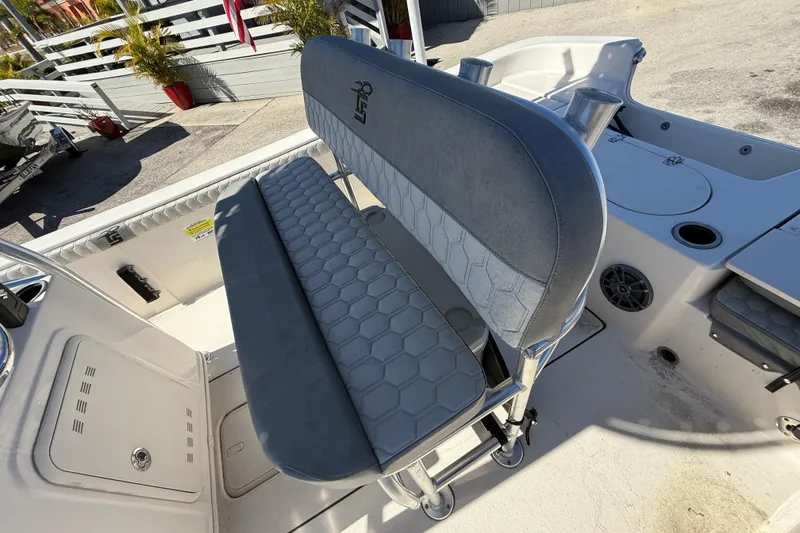Slide: The Image of 2025 Carolina Skiff 19 LS boat interior with gray seating and rod holders. - 18