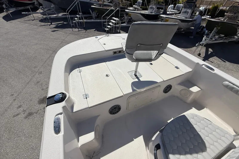 Slide: The Image of 2025 Carolina Skiff 19 LS boat interior with seating and storage compartments. - 23