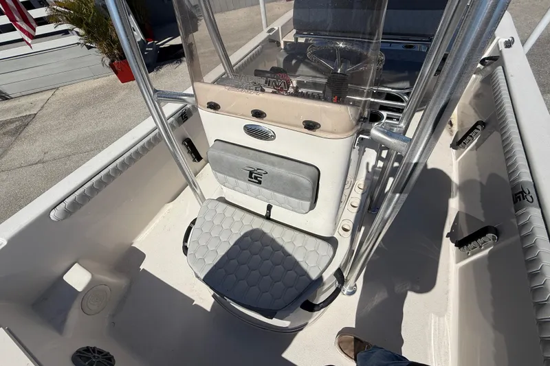 Slide: The Image of 2025 Carolina Skiff 19 LS boat interior with console and seating, showcasing modern design. - 24