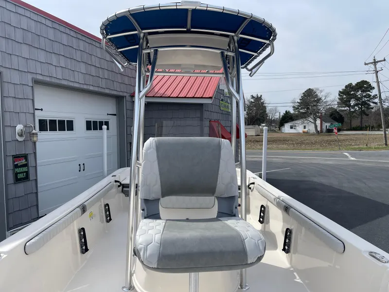 Slide: The Image of 2025 Carolina Skiff 19 LS boat on trailer under clear blue sky. - 6