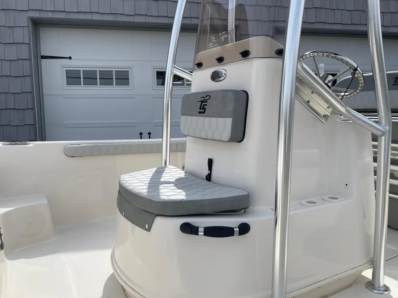 Slide: The Image of 2025 Carolina Skiff 19 LS boat interior with steering console and seating. - 9