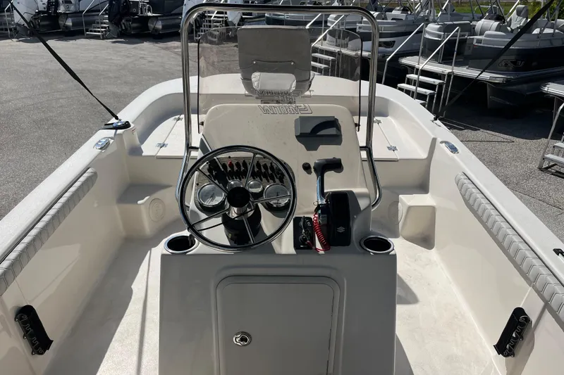 Slide: The Image of 2025 Carolina Skiff 19 LS boat interior with steering console and seating. - 5