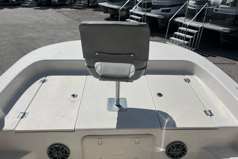 Slide: The Image of 2025 Carolina Skiff 19 LS boat deck with seating and storage compartments. - 6