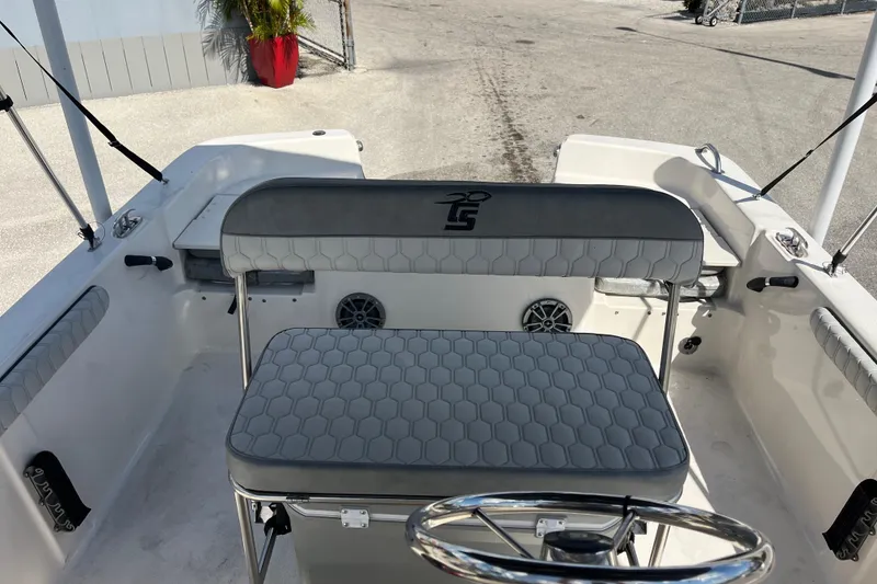 Slide: The Image of 2025 Carolina Skiff 19 LS boat interior with seating and steering wheel. - 8