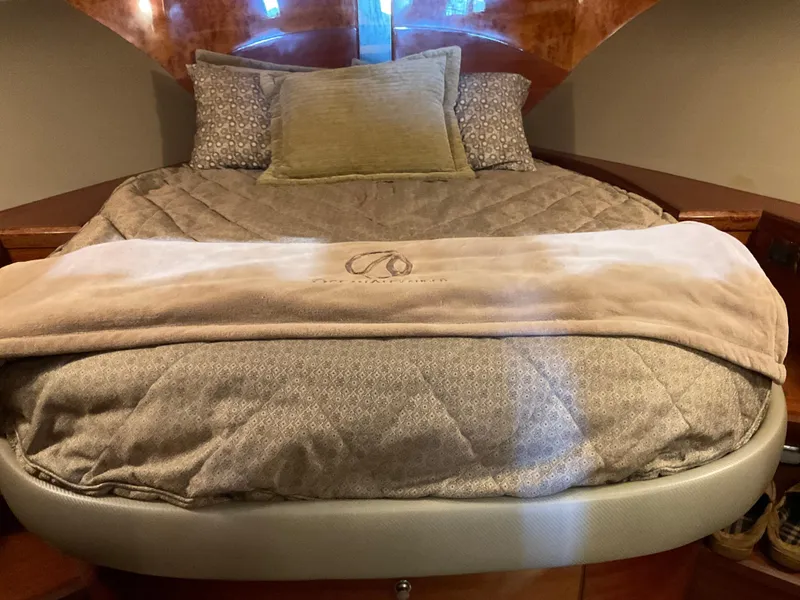 Slide: The Image of Luxurious bedroom interior of 2007 Ocean Alexander 54V yacht with plush bedding. - 16