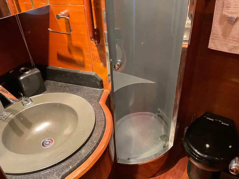 Slide: The Image of Luxurious bathroom in 2007 Ocean Alexander 54V yacht with modern sink and shower. - 18