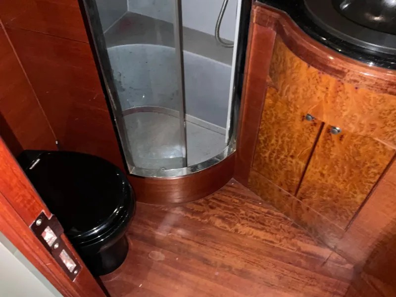 Slide: The Image of Bathroom interior of 2007 Ocean Alexander 54V yacht with shower and wooden cabinetry. - 21