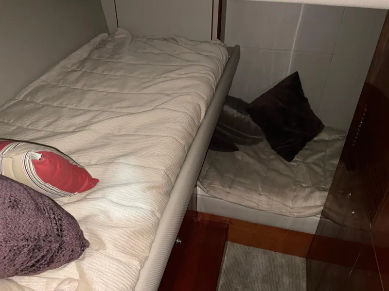 Slide: The Image of Cozy cabin interior of 2007 Ocean Alexander 54V yacht with comfortable bedding and pillows. - 22