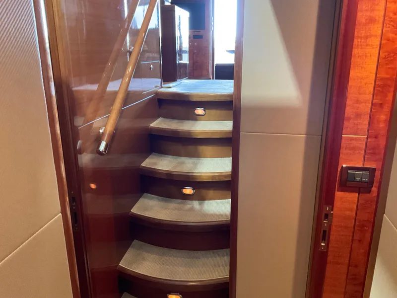 Slide: The Image of Staircase inside 2007 Ocean Alexander 54V yacht with wooden handrail and carpeted steps. - 23
