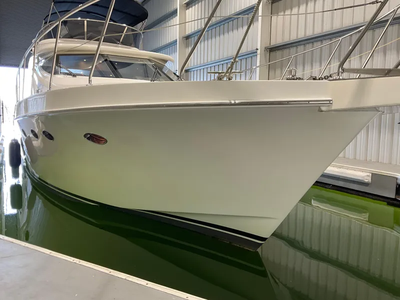 Slide: The Image of 2007 Ocean Alexander 54V yacht in a marina, side view. - 3