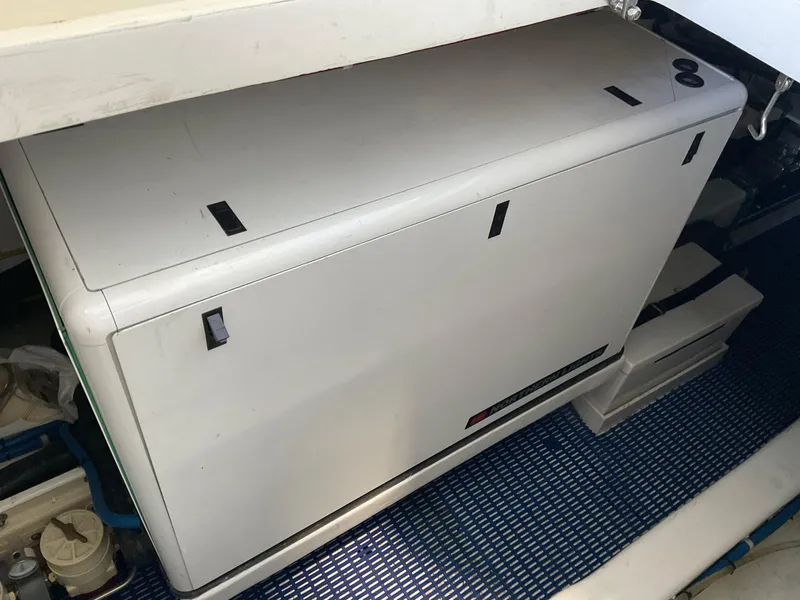 Slide: The Image of Engine compartment of a 2007 Ocean Alexander 54V yacht, featuring a generator. - 30