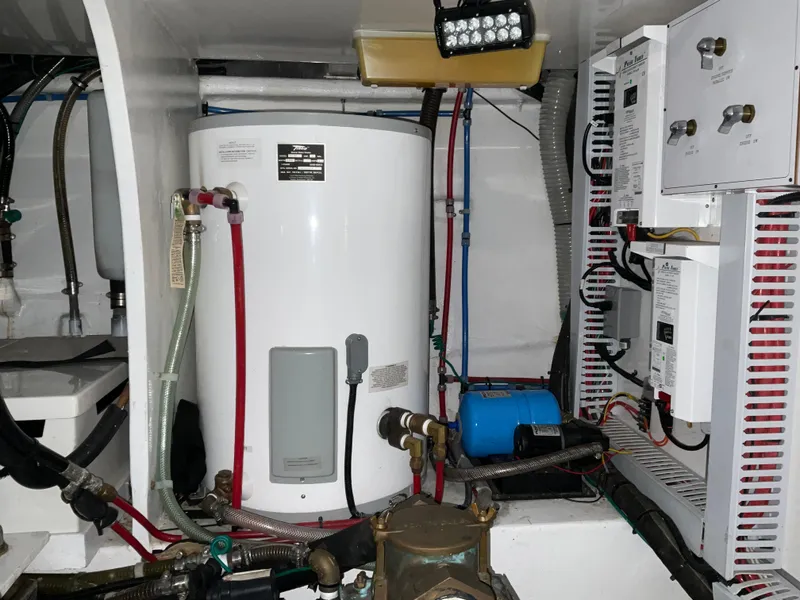 Slide: The Image of Engine room of 2007 Ocean Alexander 54V yacht with water heater and electrical systems. - 32