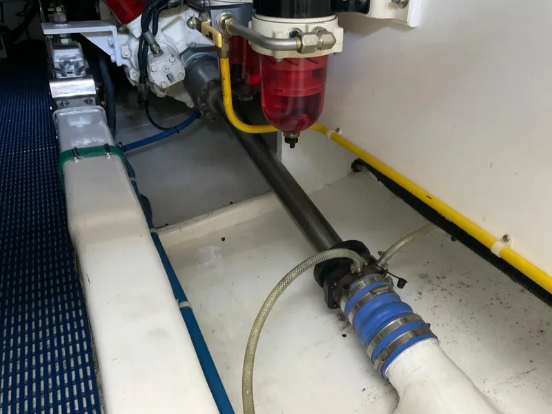 Slide: The Image of Engine compartment of a 2007 Ocean Alexander 54V yacht, showcasing mechanical components. - 33