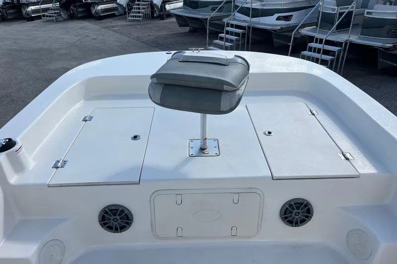 Slide: The Image of 2025 Carolina Skiff 21 LS boat deck with seating and storage compartments. - 33