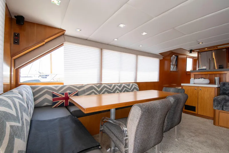 Slide: The Image of Luxurious 1988 Knight & Carver motoryacht interior with dining area and modern furnishings. - 20