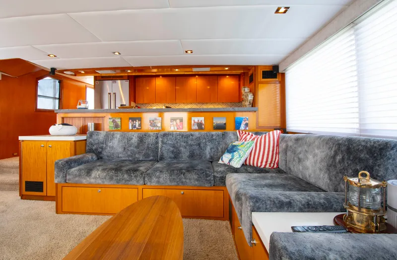 Slide: The Image of Luxurious 1988 Knight & Carver motoryacht interior with plush seating and elegant wood finishes. - 24