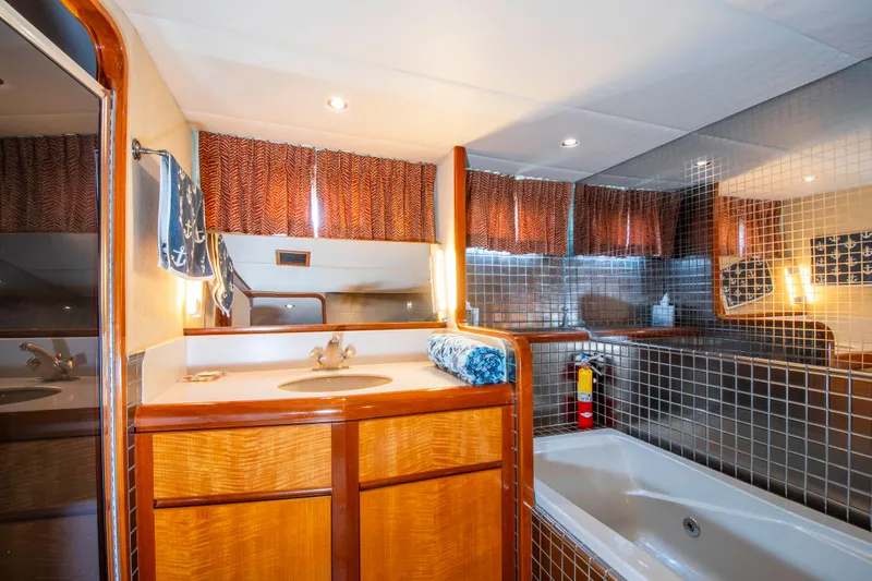 Slide: The Image of Luxurious bathroom in 1988 Knight & Carver motoryacht with wood cabinetry and modern fixtures. - 33