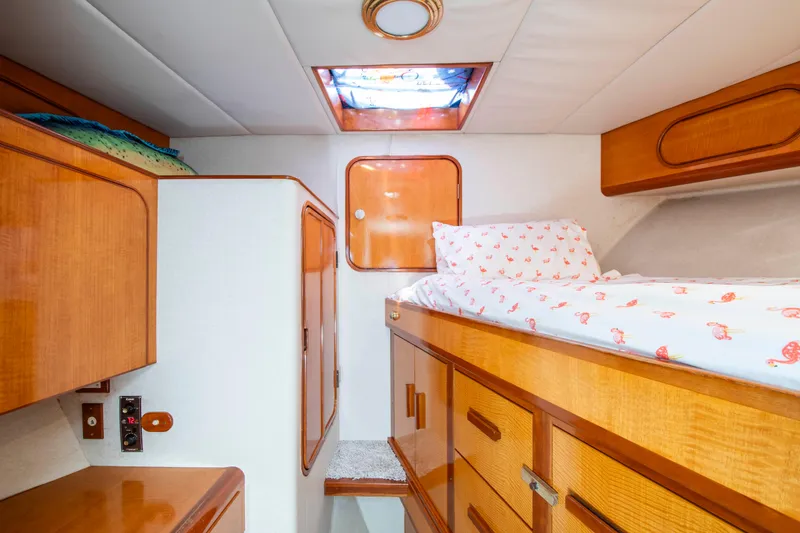Slide: The Image of Cozy cabin interior of 1988 Knight & Carver Motoryacht with wooden furnishings and skylight. - 40