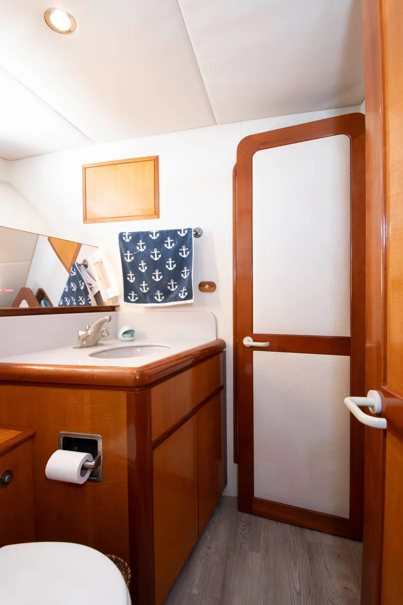 Slide: The Image of Interior of a 1988 Knight & Carver motoryacht with wood accents. - 46