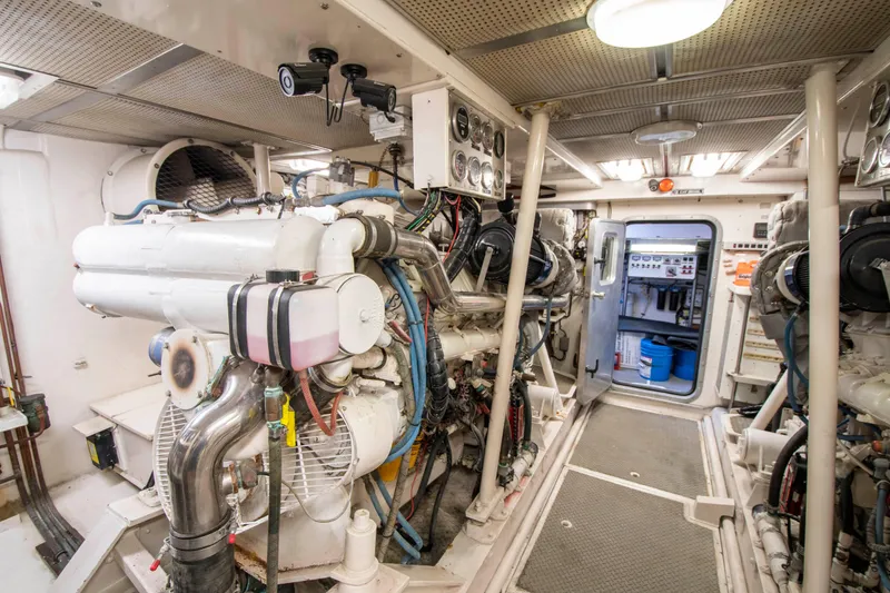 Slide: The Image of Engine room of a 1988 Knight & Carver Motoryacht with machinery and equipment. - 48