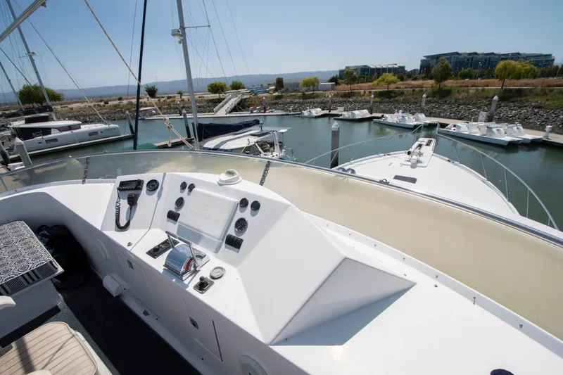Slide: The Image of Control panel of 1988 Knight & Carver Motoryacht docked in a marina. - 9