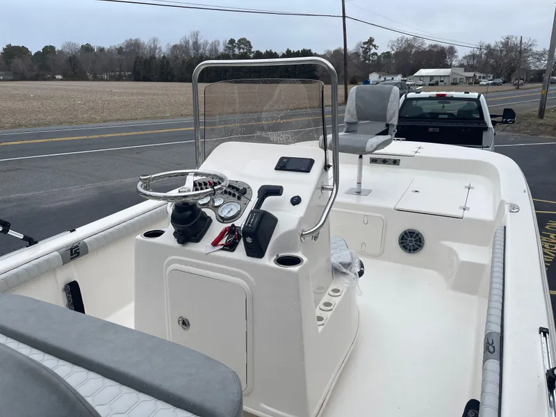 Slide: The Image of 2025 Carolina Skiff 21 LS boat interior with steering console and seating. - 13