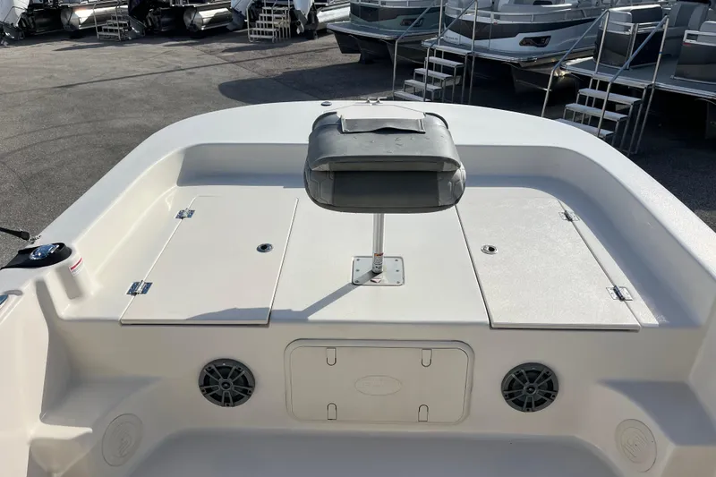 Slide: The Image of 2025 Carolina Skiff 21 LS boat interior with seating and storage compartments. - 9