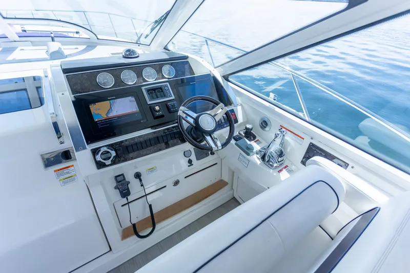 Slide: The Image of Helm of 2011 Sea Ray 450 Sundancer yacht with modern navigation equipment. - 18
