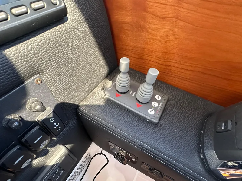 Slide: The Image of Control panel of a 2019 Cutwater C-28 boat with joysticks and switches. - 17