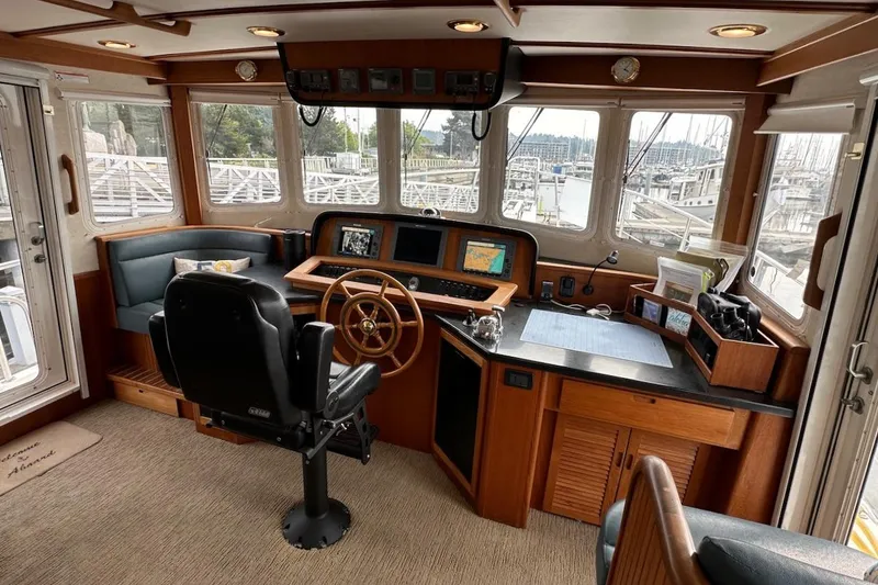 Slide: The Image of Pilothouse of 2007 Nordic Tug 54 with navigation equipment and panoramic windows. - 40