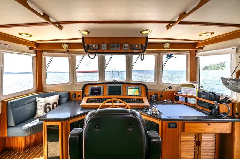 Slide: The Image of Pilothouse of 2007 Nordic Tug 54 with navigation equipment and panoramic sea view. - 42