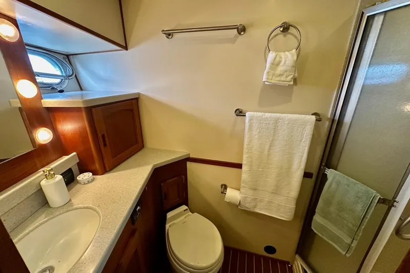 Slide: The Image of Luxurious bathroom in 2007 Nordic Tug 54 yacht with modern fixtures and elegant design. - 62