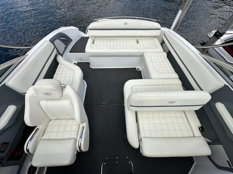Slide: The Image of 2021 Cobalt R5 boat interior with white leather seating and spacious layout. - 13