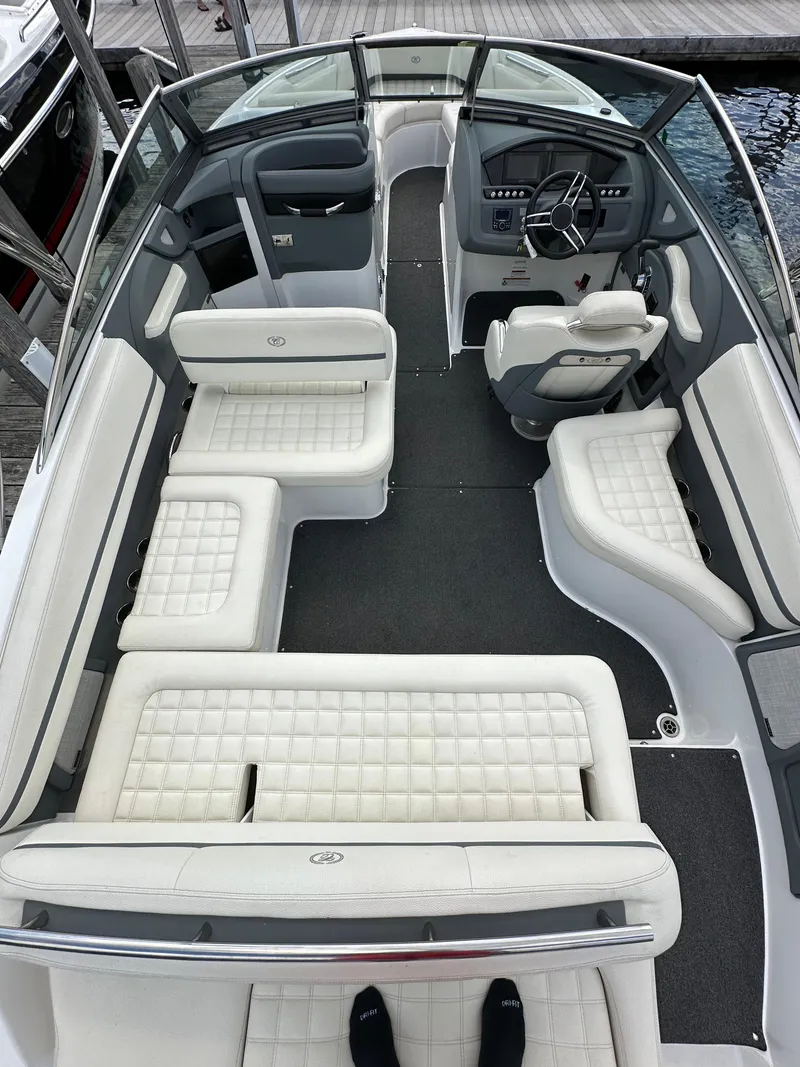 Slide: The Image of 2021 Cobalt R5 boat interior with white seating and modern dashboard design. - 14