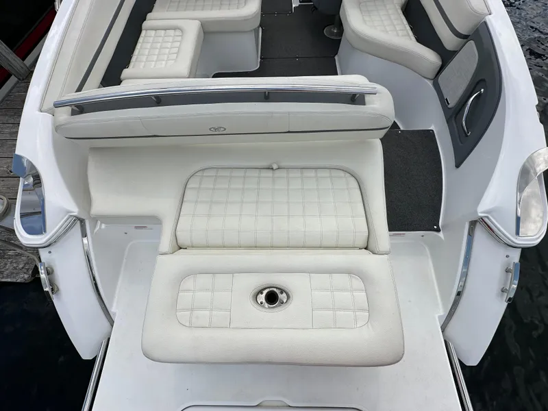 Slide: The Image of 2021 Cobalt R5 boat interior with white cushioned seating and sleek design. - 17