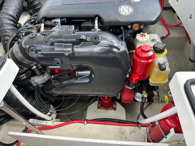 Slide: The Image of Engine compartment of a 2021 Cobalt R5 boat, featuring a Volvo Penta engine. - 20