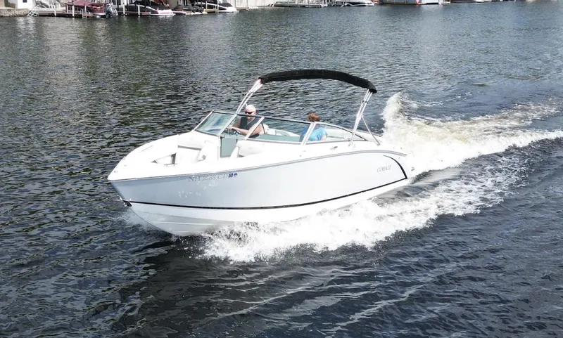 Slide: The Image of 2021 Cobalt R5 boat cruising on a lake with passengers onboard. - 30