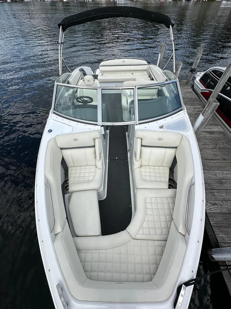 Slide: The Image of 2021 Cobalt R5 boat with white seating, docked on calm water. - 7