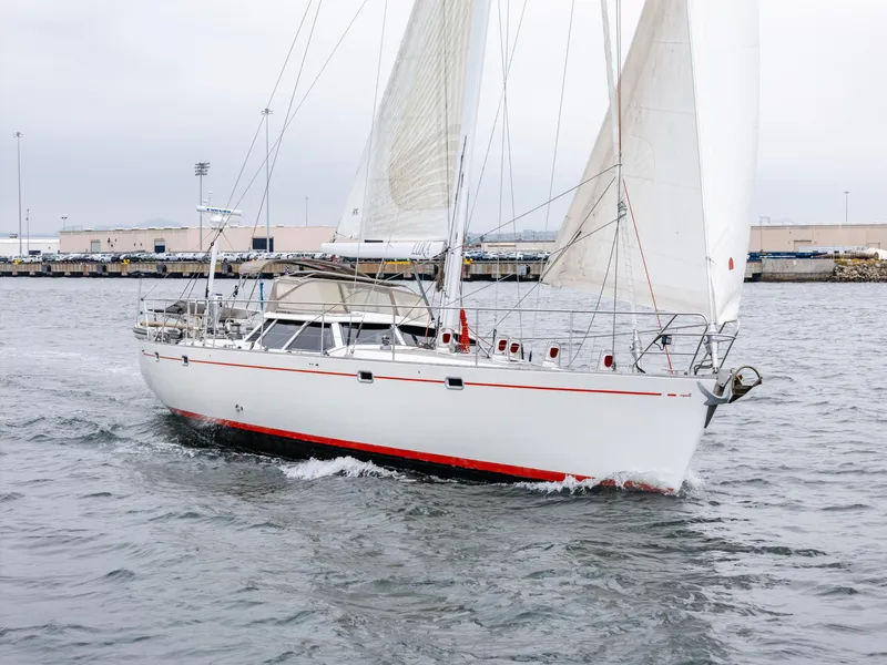 Slide: The Image of Sailing yacht Farr 60 Pilot House 1997 on open water, white hull, red stripe. - 11
