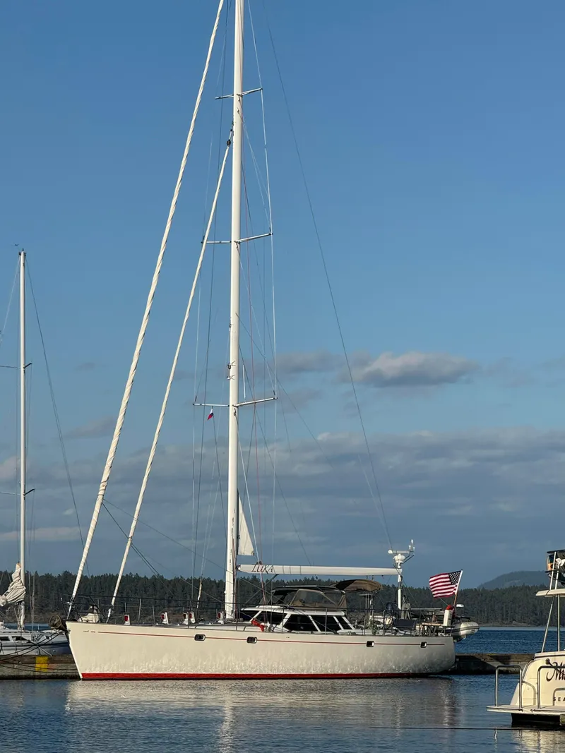 Slide: The Image of Sailboat docked at marina, Farr 60 Pilot House, 1997 model, under clear blue sky. - 15