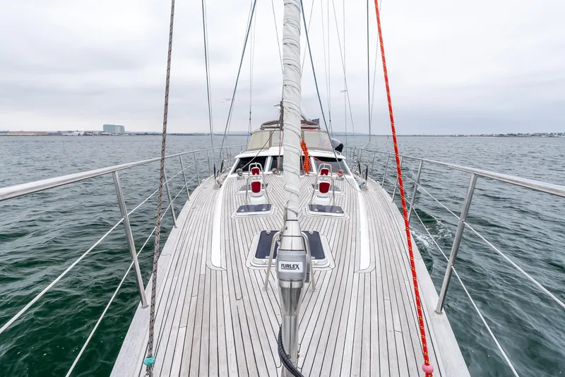 Slide: The Image of Sailing yacht Farr 60 Pilot House 1997 on open water, showcasing deck and rigging. - 16