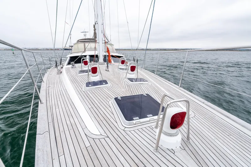 Slide: The Image of Sailing yacht Farr 60 Pilot House 1997 on open water, showcasing deck and hatches. - 17