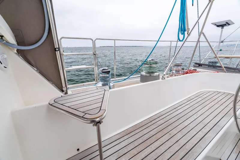 Slide: The Image of Deck view of 1997 Farr 60 Pilot House yacht with ocean backdrop. - 21