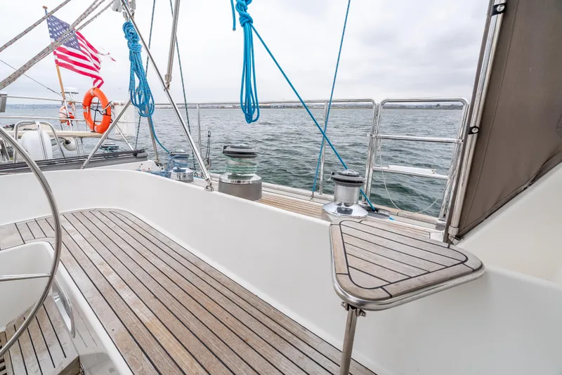 Slide: The Image of Sailing yacht Farr 60 Pilot House 1997, deck view with ocean backdrop. - 22