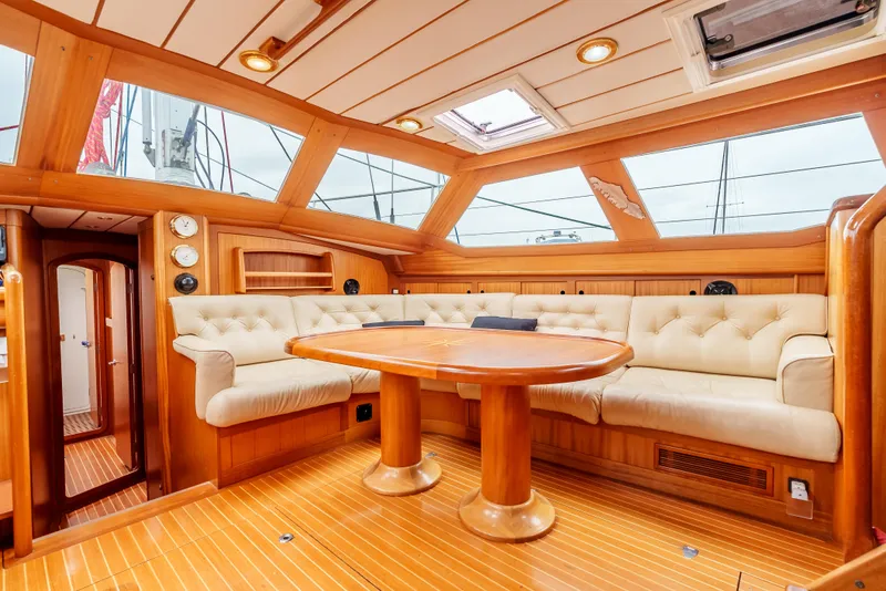 Slide: The Image of Luxurious interior of 1997 Farr 60 Pilot House yacht with plush seating and wooden finishes. - 26
