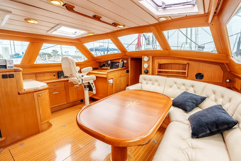 Slide: The Image of Luxurious 1997 Farr 60 Pilot House interior with elegant wood finish and plush seating. - 28
